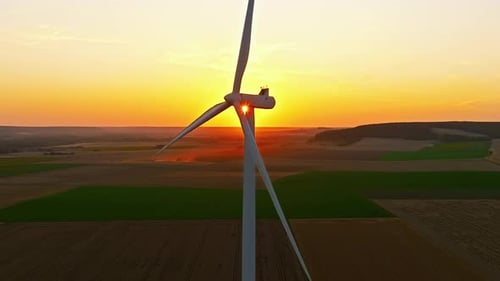 Aerial View of Windmills Turbine Rotating By Wind at Sunset Electricity Alternative Power Source