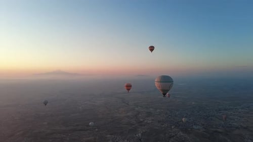 Scenic Hot Air Balloons Drifting at Sunrise