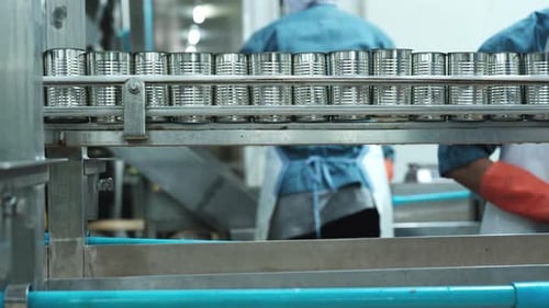 Close-up of conveyor with can, preparing for instant food production industry.