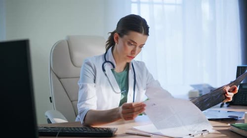 Thoughtful Doctor Analyzing Xray in Medical Office Closeup Woman Looking Scan
