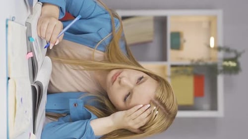 Tired Student Studying at Home