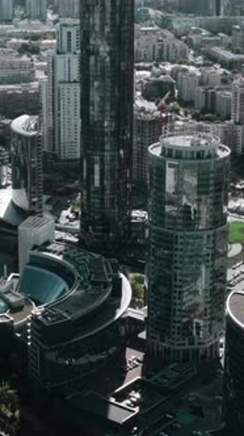 Helicopter View of the Builtup Summer City Stock Footage Sunny View of the City Center with