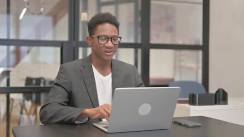 Young Adult in Video Conference Call at Office