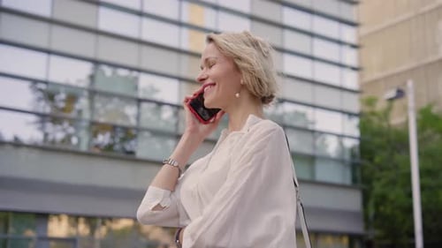 Woman Talking on Phone in Urban Setting