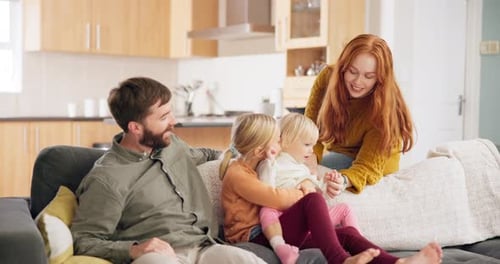 Family Relaxing Together on Couch at Home