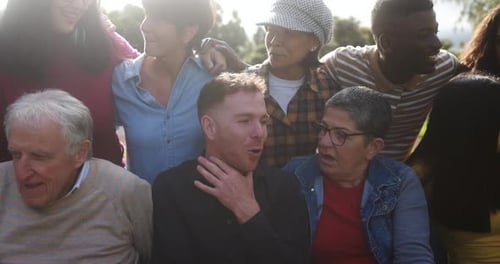 Multigenerational friends embrace diversity and connection at a USA city park celebration