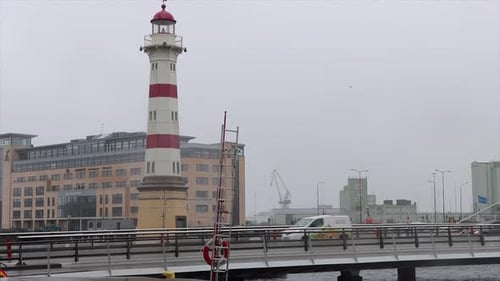 Light traffic driving past Malmo Old Lighthouse, Malmo Sweden