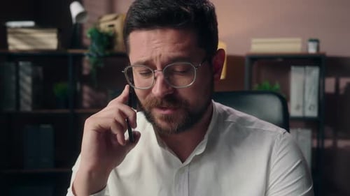 Young Adult Man Talking on Smartphone