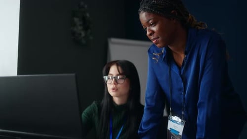 Women in Office Two Ladies of Different Ethnicities Communicating in Working Room