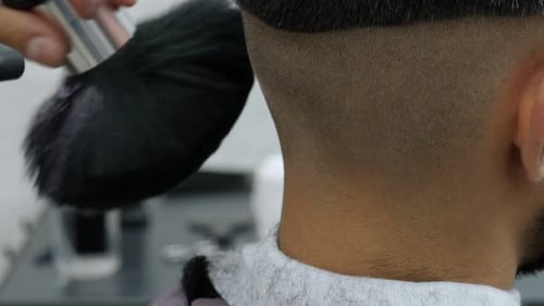 Barber Brushing Hair After Haircut Close Up