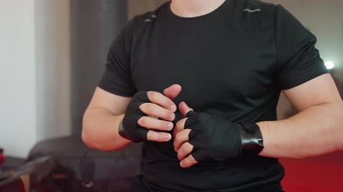 Man Preparing for Boxing Training in Gym