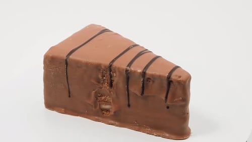 Delicious Chocolate Cake Rotating on White Background