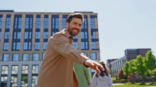 Parents Kids Walking Together at Greenery Area Back View Family Holding Hands