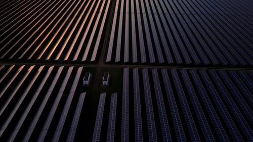 Aerial View of Solar Panels at Sunset