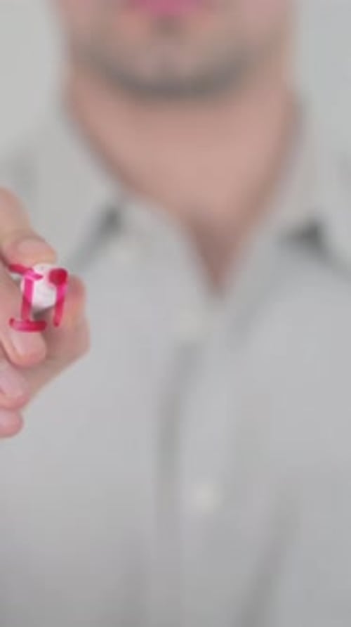 Man Writes Internet on Glass Surface with Marker