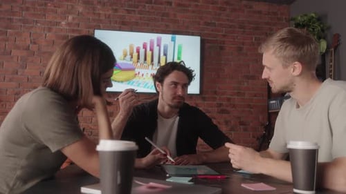 Young Adults Collaborating in a Modern Office