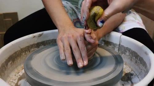 Potter Shaping Clay on a Wheel Close Up