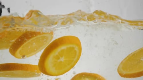 Orange Slices Dropped in Water