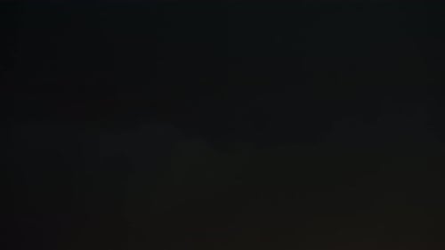 Lightning Strikes on a Dark, Cloudy Night Sky