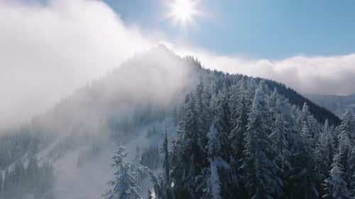 Flying Through Clouds Above Mountain Peaks White Cold Winter Sun Shining Nature