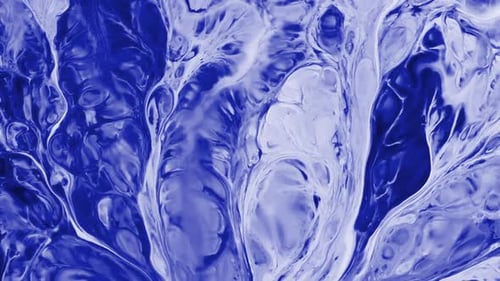 Blue and white ink swirling and mixing beautifully