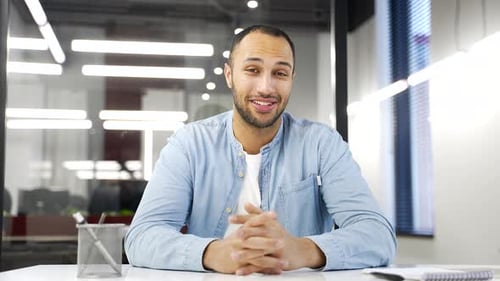 Webcam view. Confident african american businessman talking on a video call looking at camera