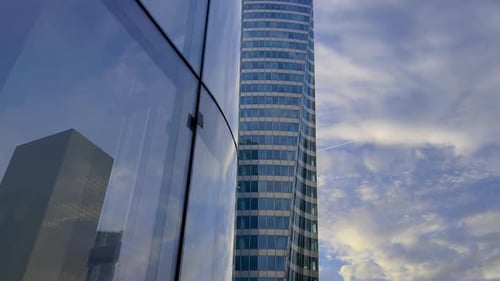Modern Glass Office Building Exterior in Urban Setting