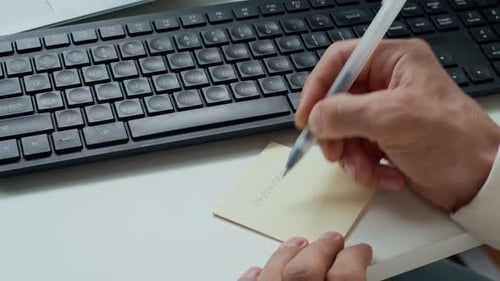 Writing Password on Note Next to Keyboard