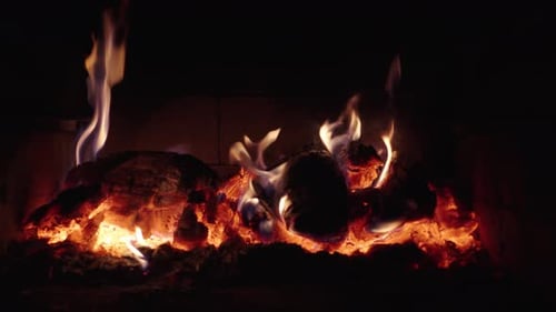 Burning Fireplace Embers with Fiery Orange Flames