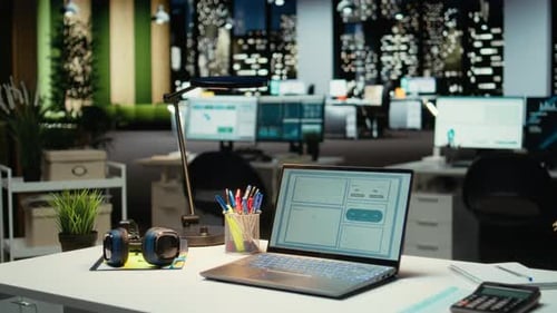 Modern Business Office with Forecasting Metrics and Graphs on Desk