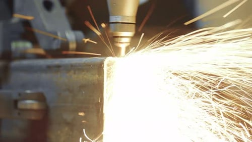 Industrial cnc laser cutting machine producing sparks