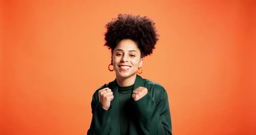 Success, fist pump and face with woman in studio for cheering, news and announcement