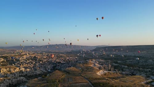 Hot Air Balloons Soar Over Cappadocia Landscape