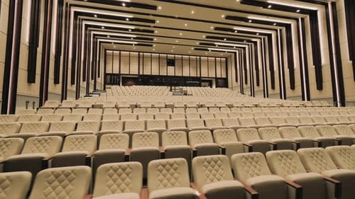 Large empty conference hall in modern style with white chairs. slow motion.4K.2