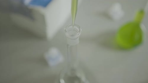 Liquid Being Poured Into Science Flask