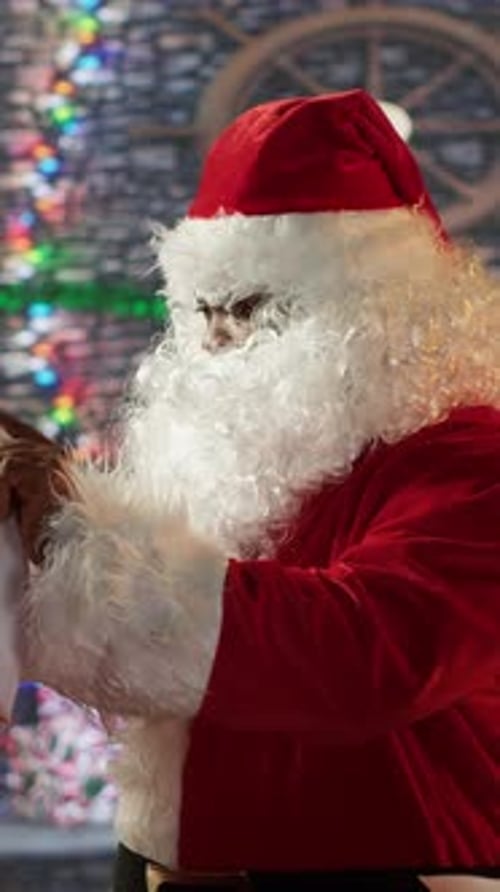 Vertical Video Amazed African American Santa Claus Opening His Bag Full of Gifts