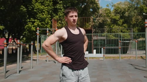Muscular Man Warming Up Before Outdoor Gym Workout