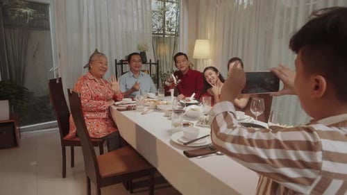 Family Gathers For Meal and Photo Together