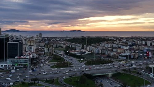 Aerial View of Urban Cityscape near Ocean at Sunrise