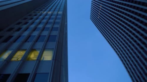 Low Angle Spinning Shot of Skyscrapers in the Tokyo. Financial District. Skyscape and Cityscape in