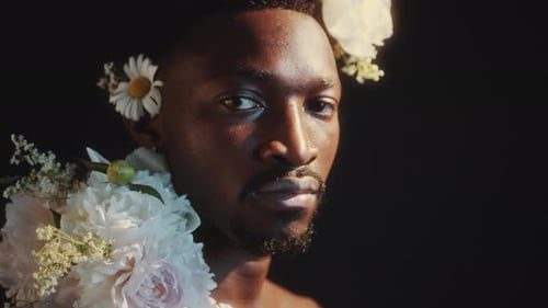 Man with Flowers Looking at the Camera