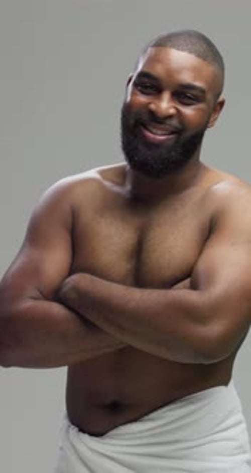Man with Beard Smiling with Arms Crossed