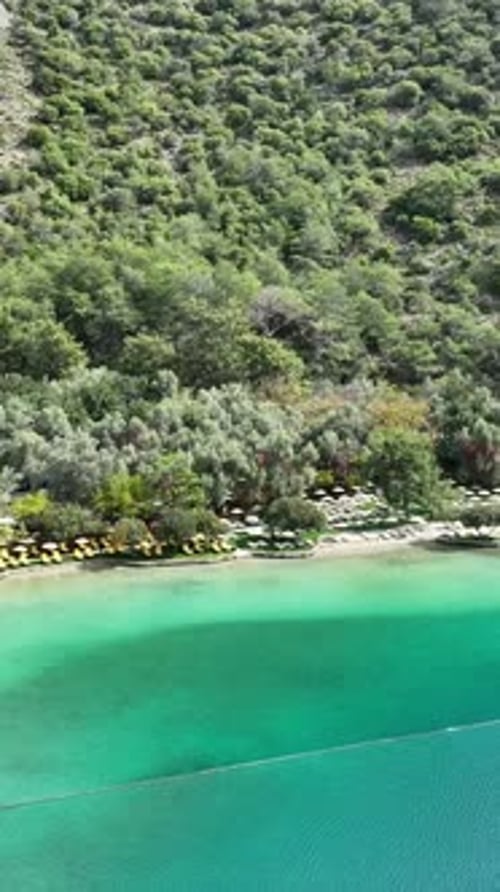 Aerial view of sandy beach and blue sea