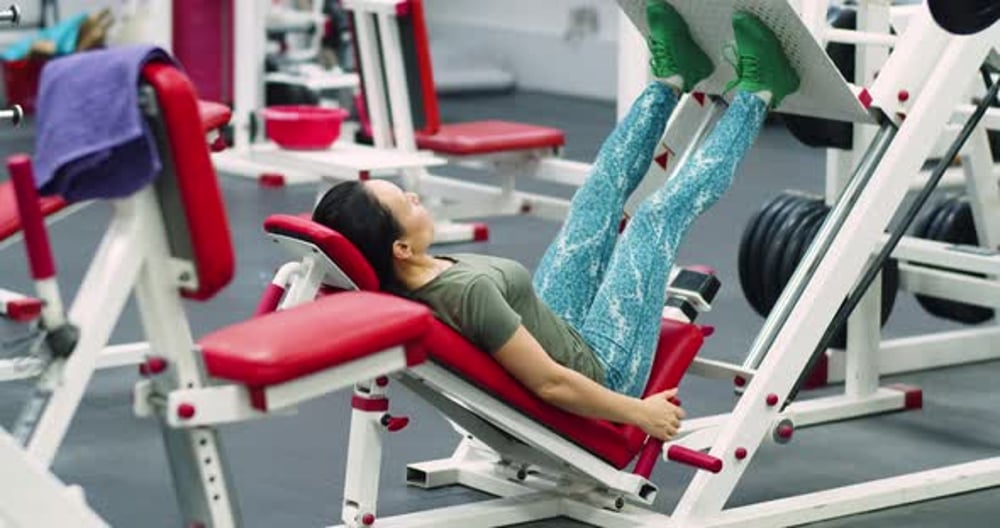 Woman Using Leg Press Machine at the Gym, Sports Stock Footage ft. leg ...