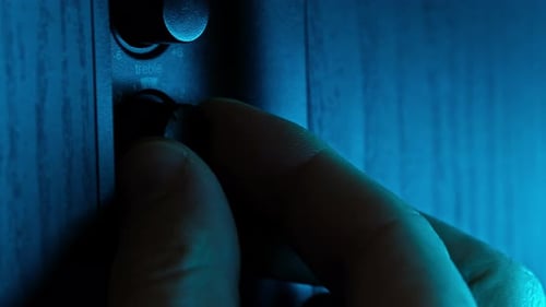 Male Hand Adjusting Volume And Tone Control Of Music Audio Speaker System