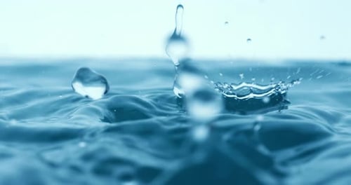 Rain water drops falling in super slow motion.