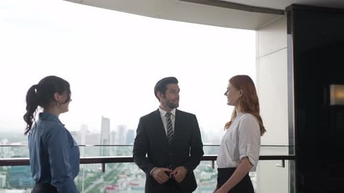 White collar worker meeting at high rise tower.