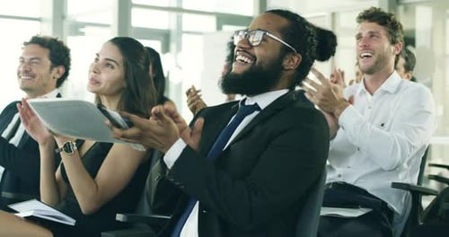 Smiling Audience Applauding at Corporate Event