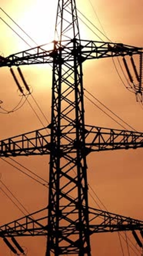 High power electricity poles. View of high voltage electrical transmission tower. Vertical video