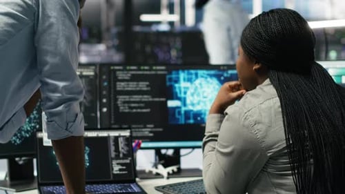 Data Center Manager Supervising Worker Deploying AI Solutions